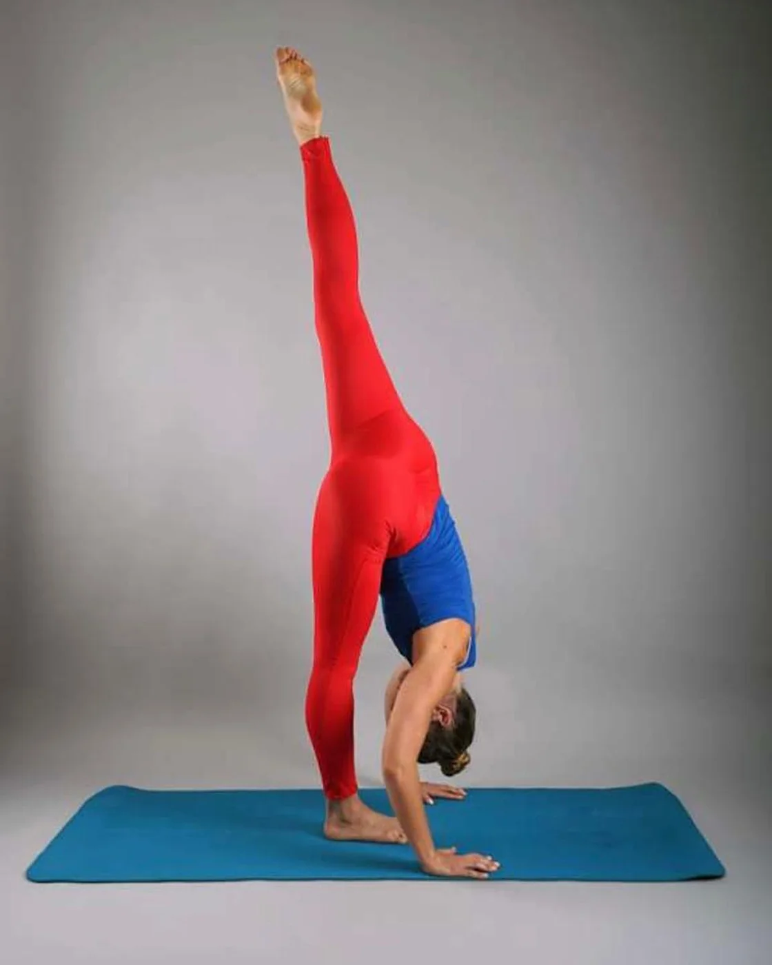 Martina practicing yoga in her movement studio